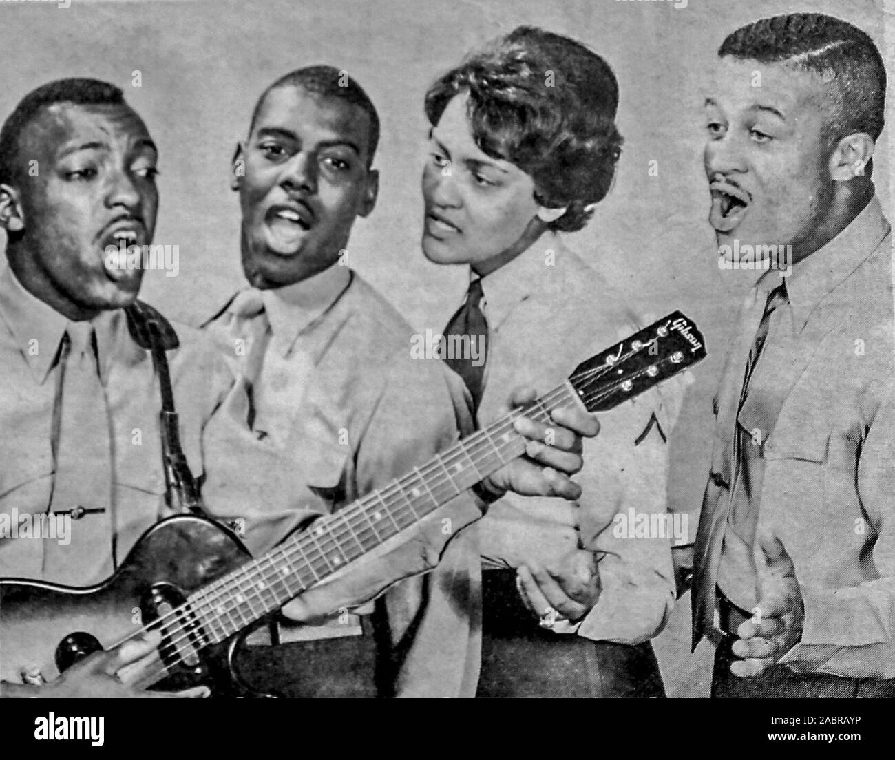 the-swinging-essex-pooling-their-voices-these-four-camp-lejeune-marines-left-to-right-lcpl-walter-vickers-pfcs-billy-hill-anita-humes-and-rudy-johnson-make-up-the-singin-swingin-team-of-the-essex-breaking-into-the-recording-field-with-the-roulette-company-they-have-tentatively-scheduled-a-release-entitled-easier-said-than-done-and-are-you-goin-my-way-for-april-15-2ABRAYP.jpg