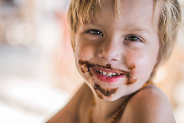 happy-little-boy-with-chocolate-mustache-and-beard.jpg