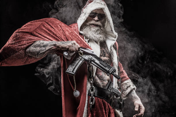 bad-santa-claus-with-gun-picture-id1175870138