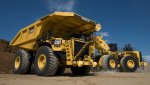 Cat_793F_mining_truck_being_loaded_by_Cat_wheel_loader.5aec71c53c71e.jpg
