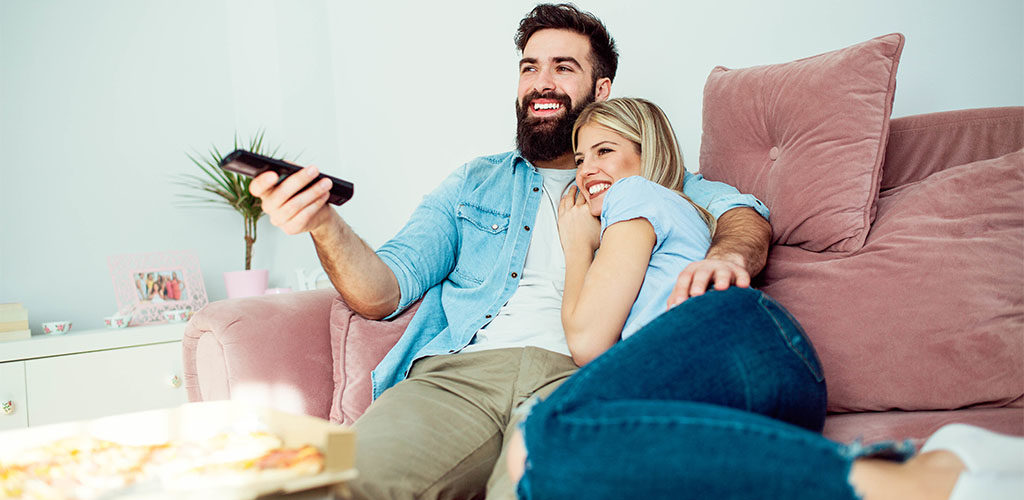 Man-and-woman-watching-Netflix-1024x500.jpg