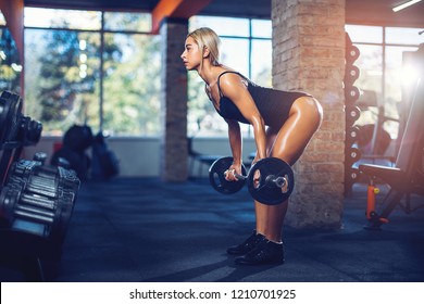 sexy-athletic-girl-working-out-260nw-1210701925.jpg