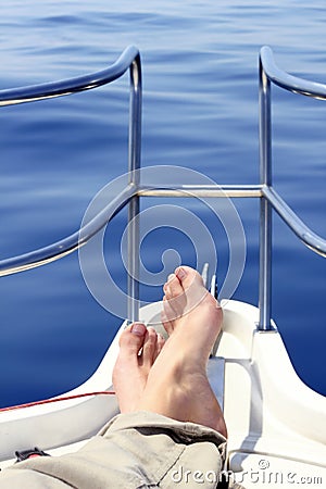 boat-bow-man-feet-blue-sea-view-15355689.jpg