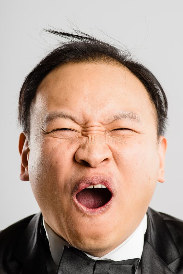 funny-looking-asian-man-portrait-29778610.jpg