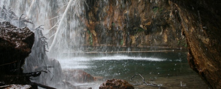 Under-The-Falls-At-Hanging-Lake-744x302.jpg