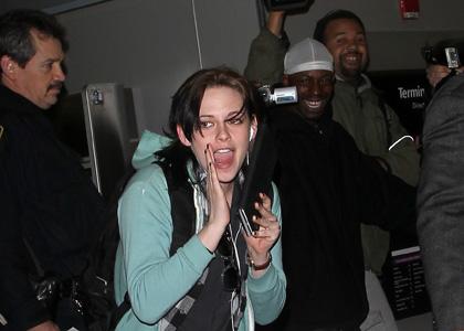 kristen-stewart-jfk-clapper.jpg