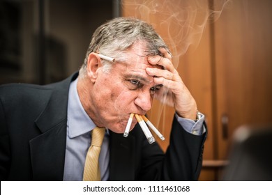 nervous-businessman-smoking-many-cigarettes-260nw-1111461068.jpg