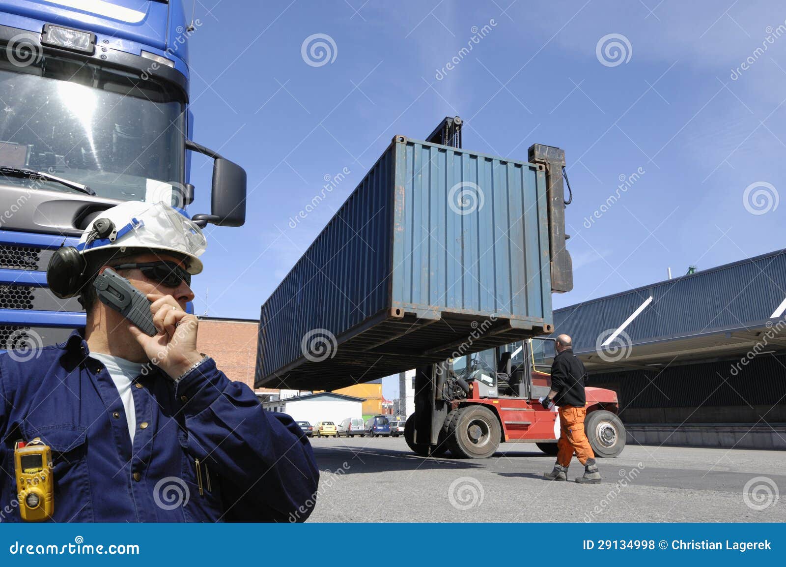 forklift-hoisting-cargo-shipping-containers-29134998.jpg