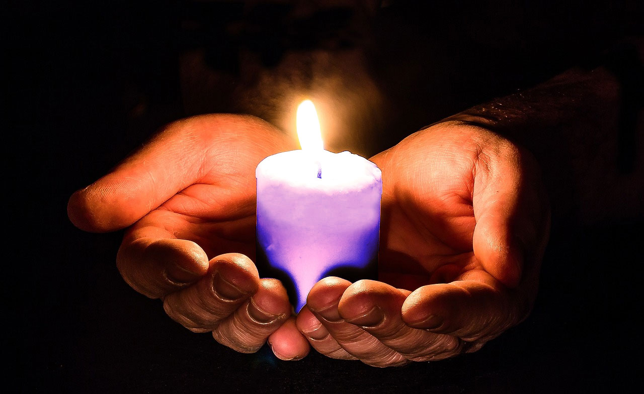 purple-candle-in-hand_orig.jpg